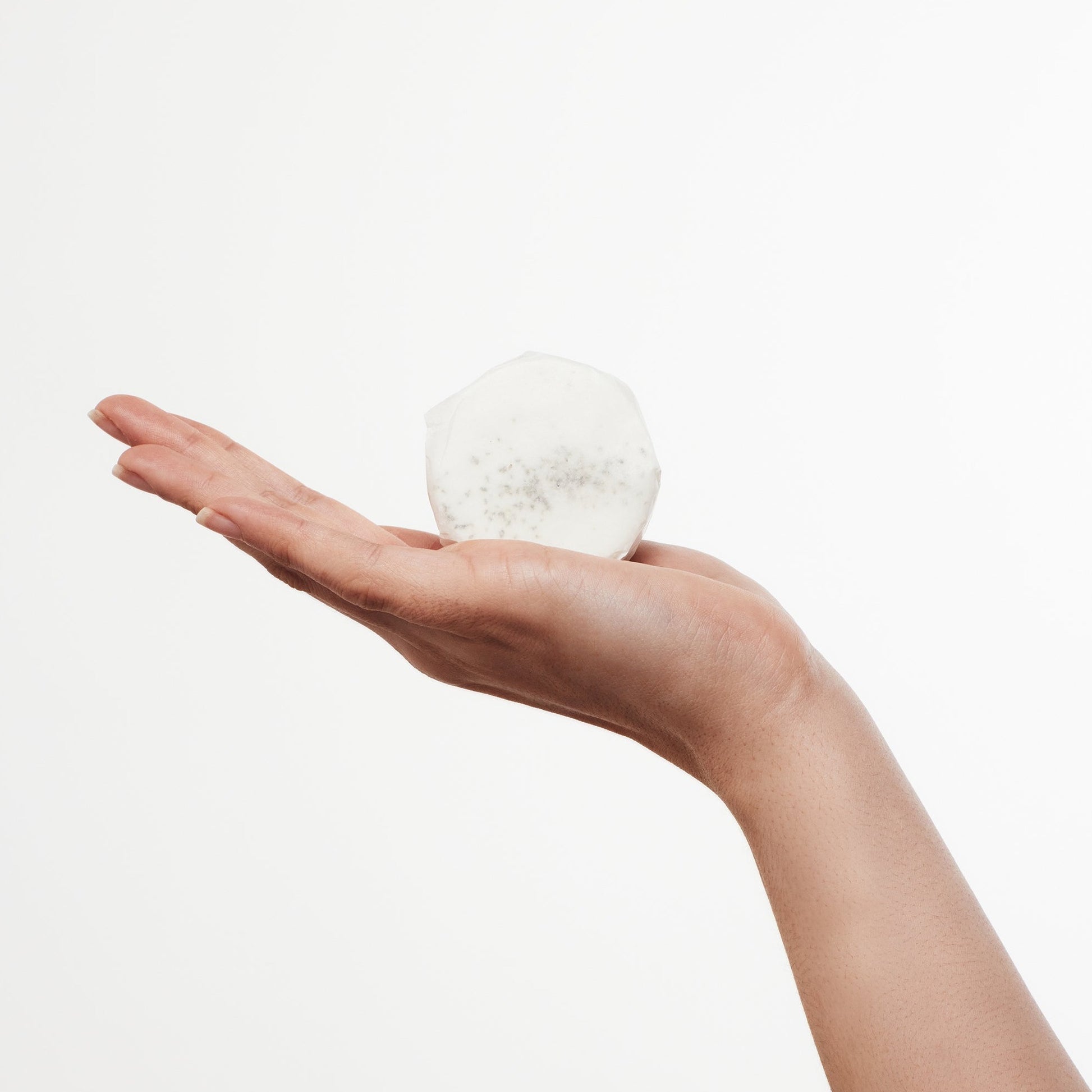 Peppermint, Eucalyptus, and Ravensara shower steamer wrapped in compostable packaging