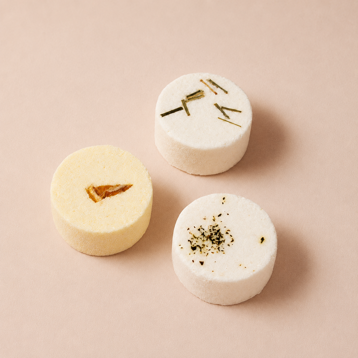 Sunday Steam Energise & Refresh shower steamer trio with citrus, rosemary and botanical-topped steamers on a soft beige background.